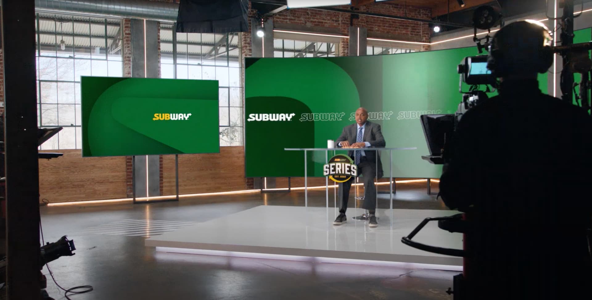 custom branded video production set with scenic walls and platform stage