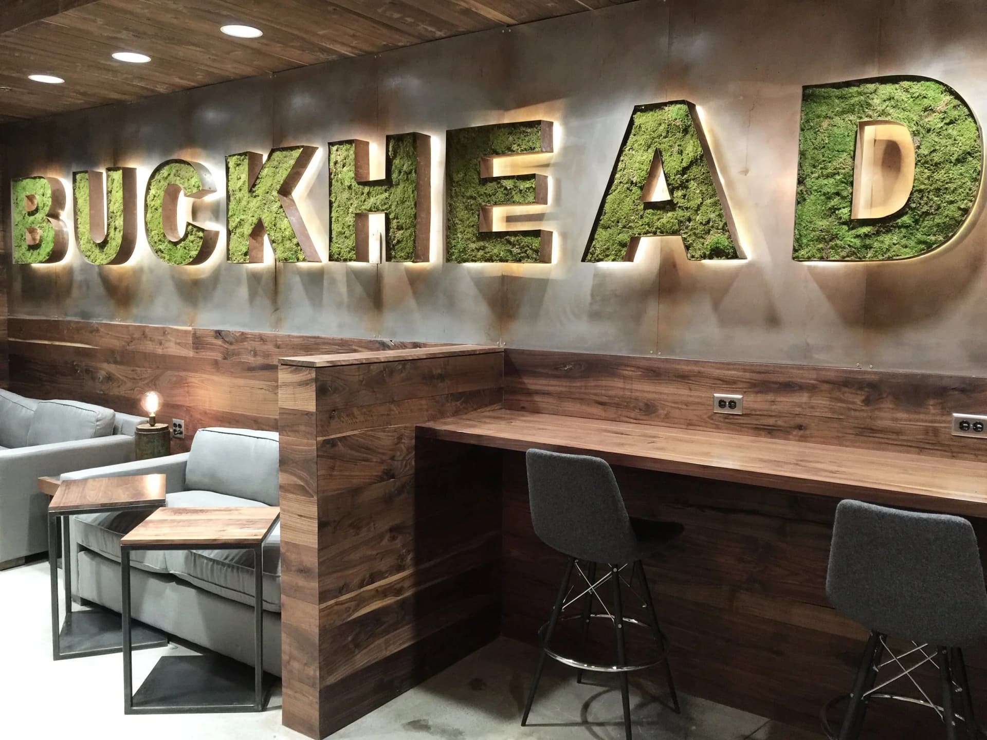custom hospitality wall with illuminated buckhead dimensional lettering