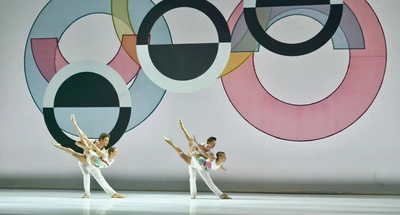 dance performance stage with suspended circular scenic elements