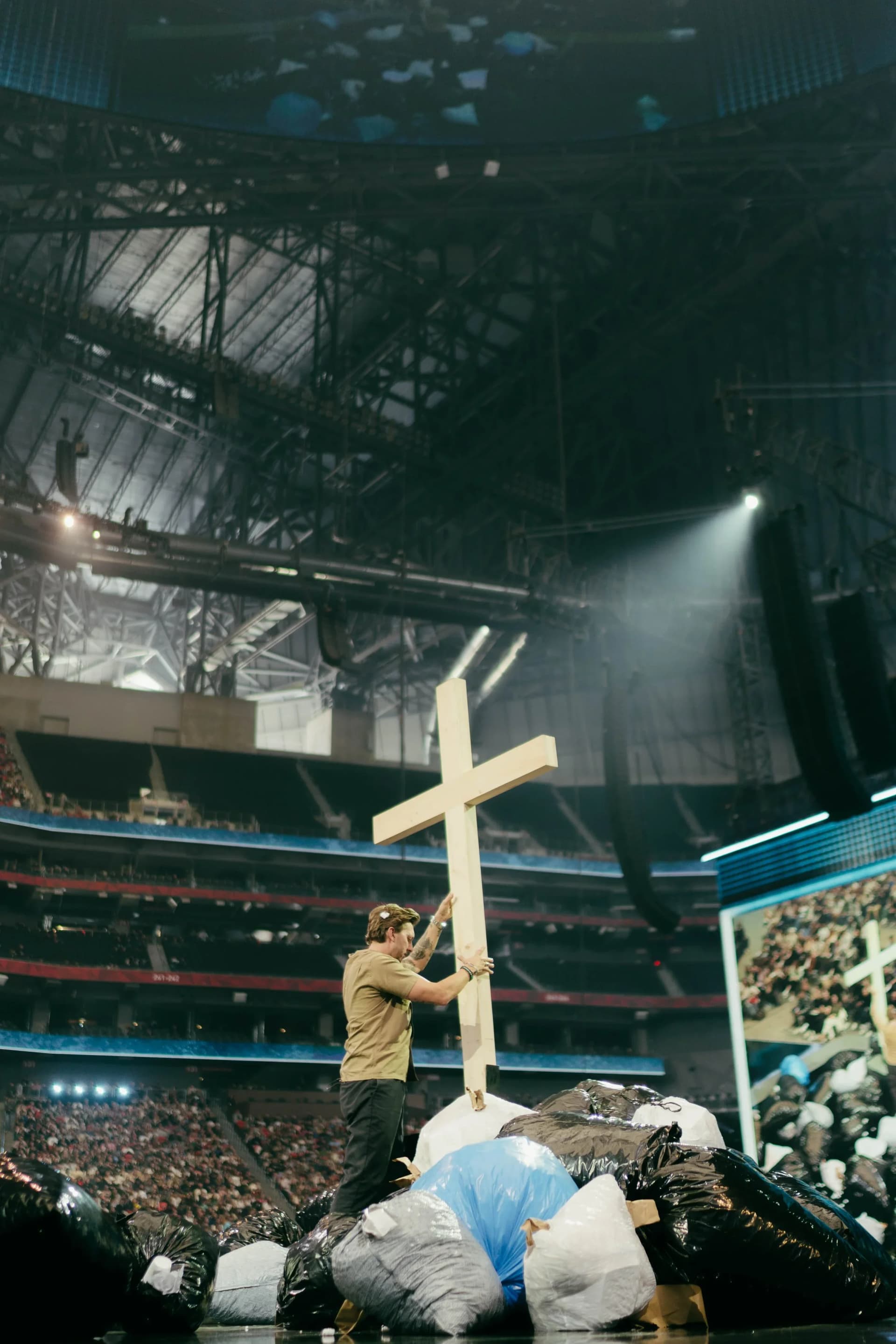 live event stage with oversized cross prop and scenic elements